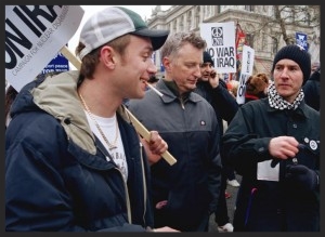 3D alongside Damon Albarn and Billy Bragg protesting at a march in London, on the same week as 100th Window's release about the then eminent US-UK led invasion of Iraq. Photo Credit. Watch a news clip of this event on YouTube.